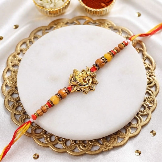Divine Golden Ganesha Rakhi