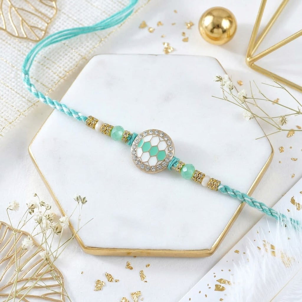 Turquoise Grace Rakhi With Kaju Katli & Ferrero Rocher