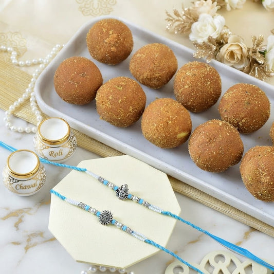 Sacred Ganesha & Surya Rakhi Set With Besan Laddu