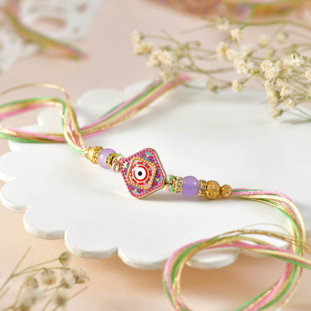 Designer 4-Piece Rakhi Collection with Traditional Besan Laddu